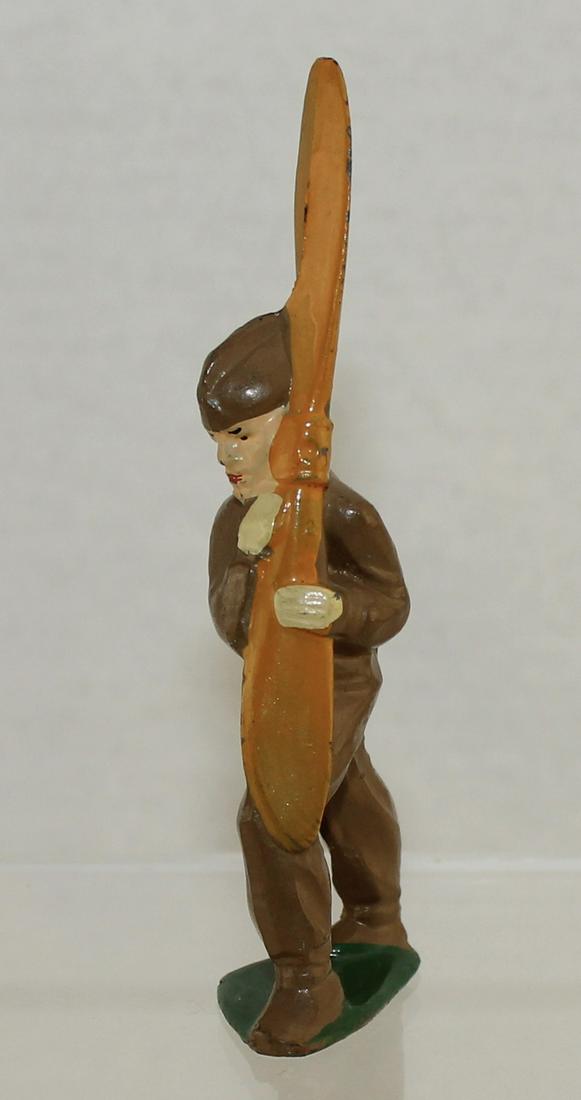 Manoil M114b Aviator with Yellow Orange Prop: Manoil Dimestore. M114b with Yellow Orange Propeller. Lower Hand Curves Over Prop. Scarce. 1 Piece. Condition Very Good to Excellent. No Box.