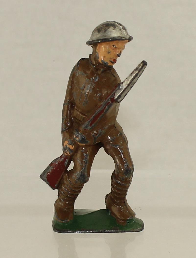 Manoil M65 Soldier with Bayonet: Manoil Dimestore. Jabbing with Bayonet. 1 Piece. Condition Good. No Box.