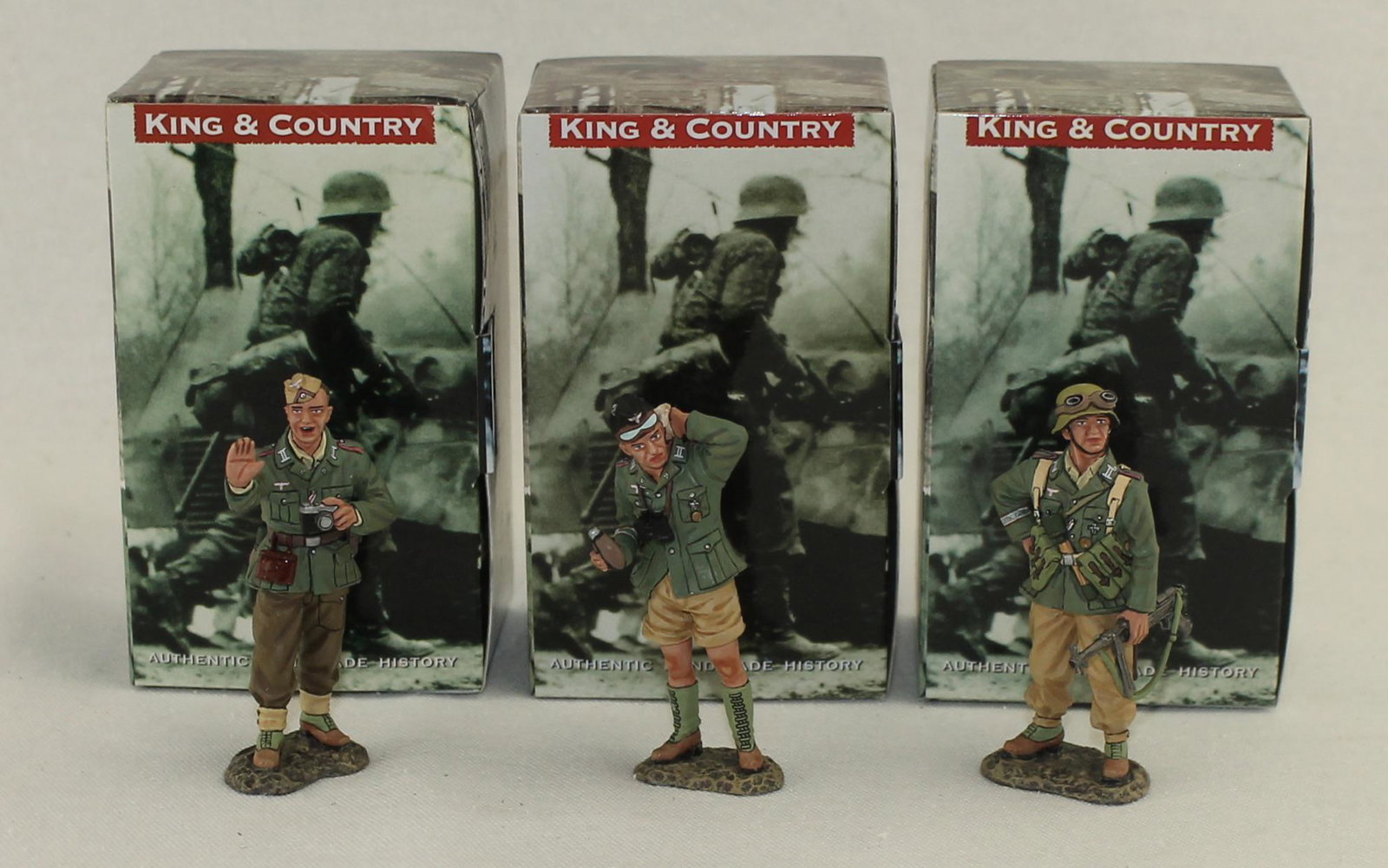 King & Country Lot Panzer Officer Sergeant: German Afrika Korps. Lot includes Set #AK0787 Photographer, Set #AK088 Feldwebel and Set #AK089 Panzer Officer. 3 Pieces. Condition Excellent. Boxes Very Good.