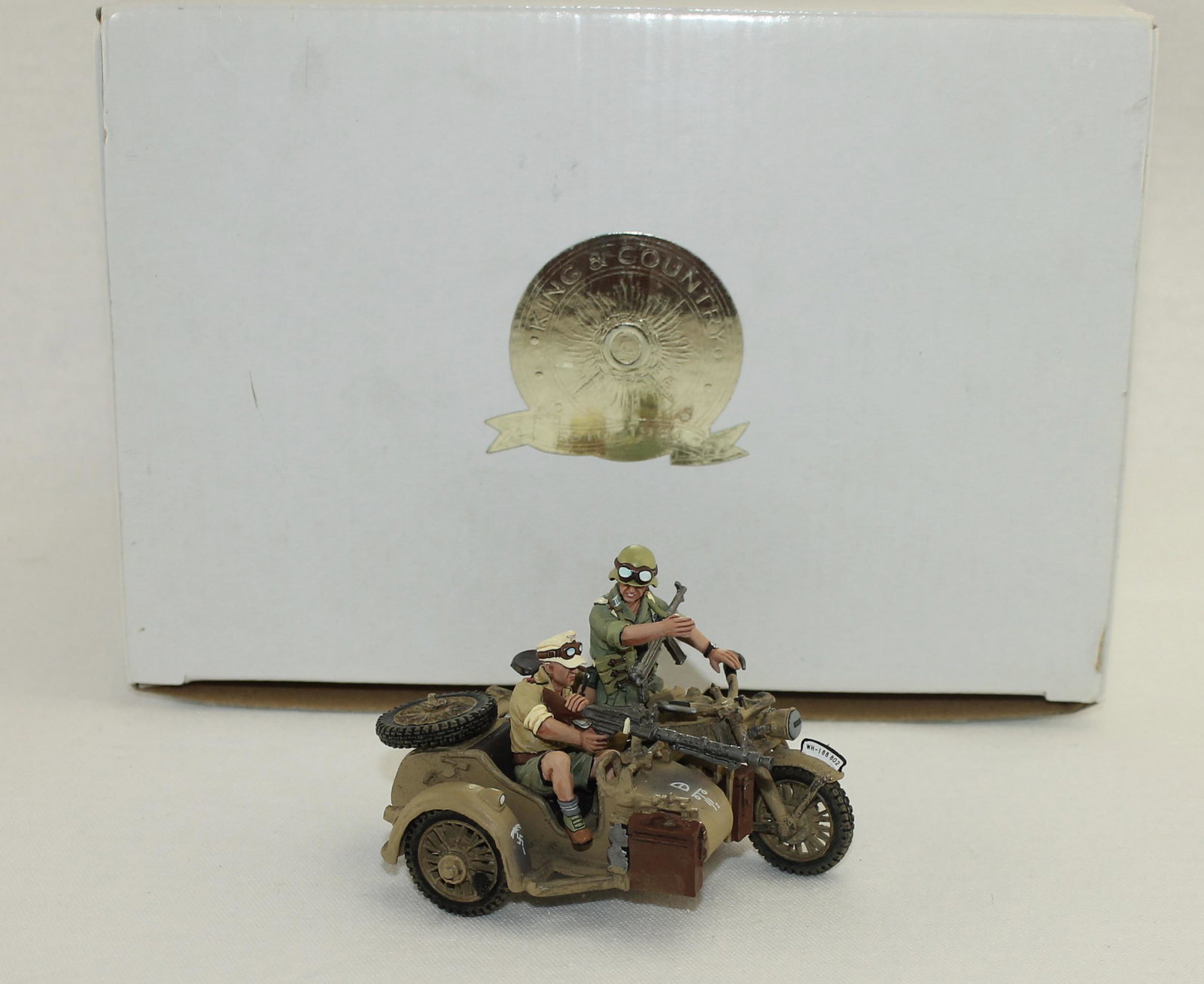 King & Country AK035 Motorcycle with Machine Gun: German Afrika Korps. Motorcycle with Machine Gun. 1 Piece. Condition Excellent. Box Very Good.
