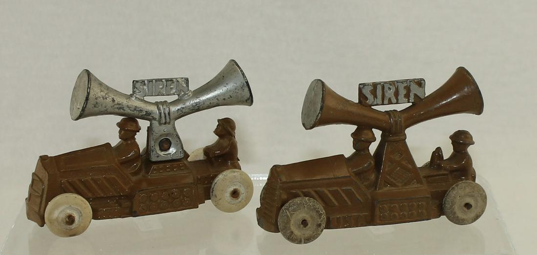 Manoil Lot Armored Car with Siren: Lot includes Manoil #75a Armored Car with Siren Cast Separately and Manoil #75a Armored Car with Siren. White Rubber Tires on Both Vehicles. 2 Pieces. Condition Good to Very Good. No Box.