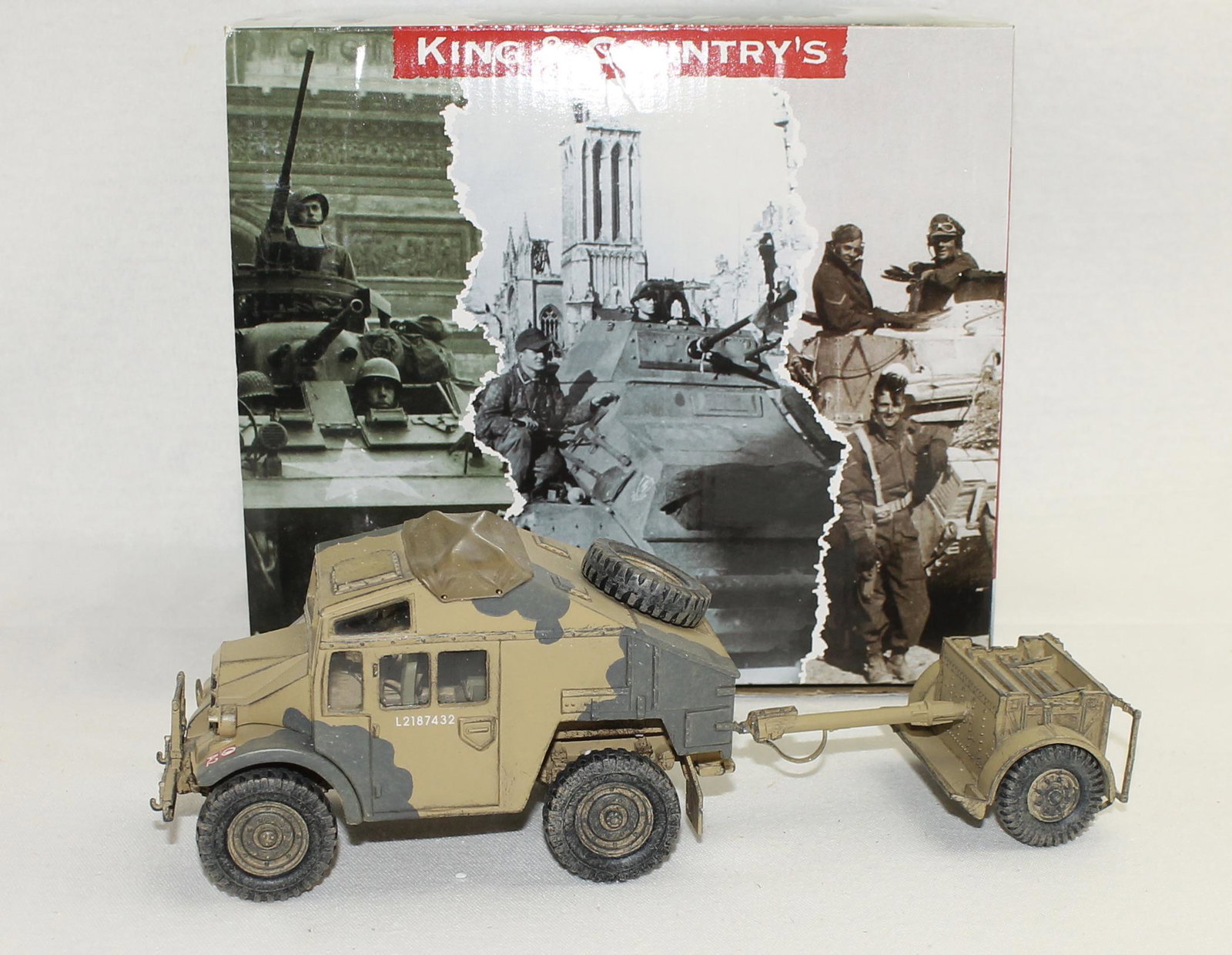 King & Country EA085 Quad Gun Tractor: British Eighth Army. Desert Quad Gun Tractor with Limber. 2 Pieces. Condition Very Good to Excellent. Towing Hitch on Trailer Repaired. No Box.