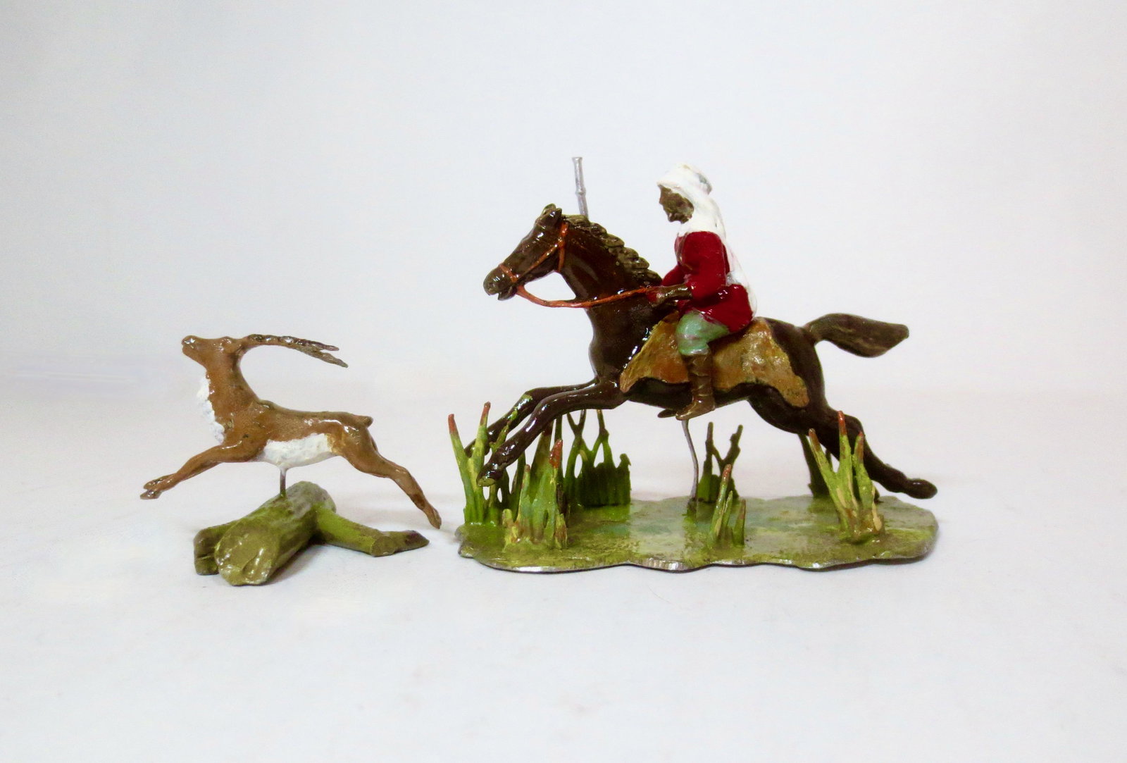 Potsdamer Zinnfiguren "The Gazelle Chase": Wonderful Arab on Rocking Horse chasing Gazelle jumping over log. Mint condition. Unboxed.