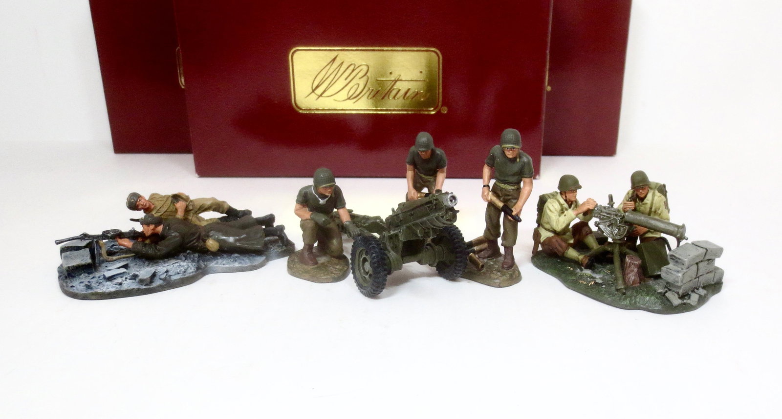 Britains World War Two Sets: Russian Light Machine Gun With Crew #17592, U.S. Water-Cooled Browning Team #17492, and U.S. 75-mm Pack Howitzer And Crew #17249. 6 pieces. Mint condition. Boxes excellent.
