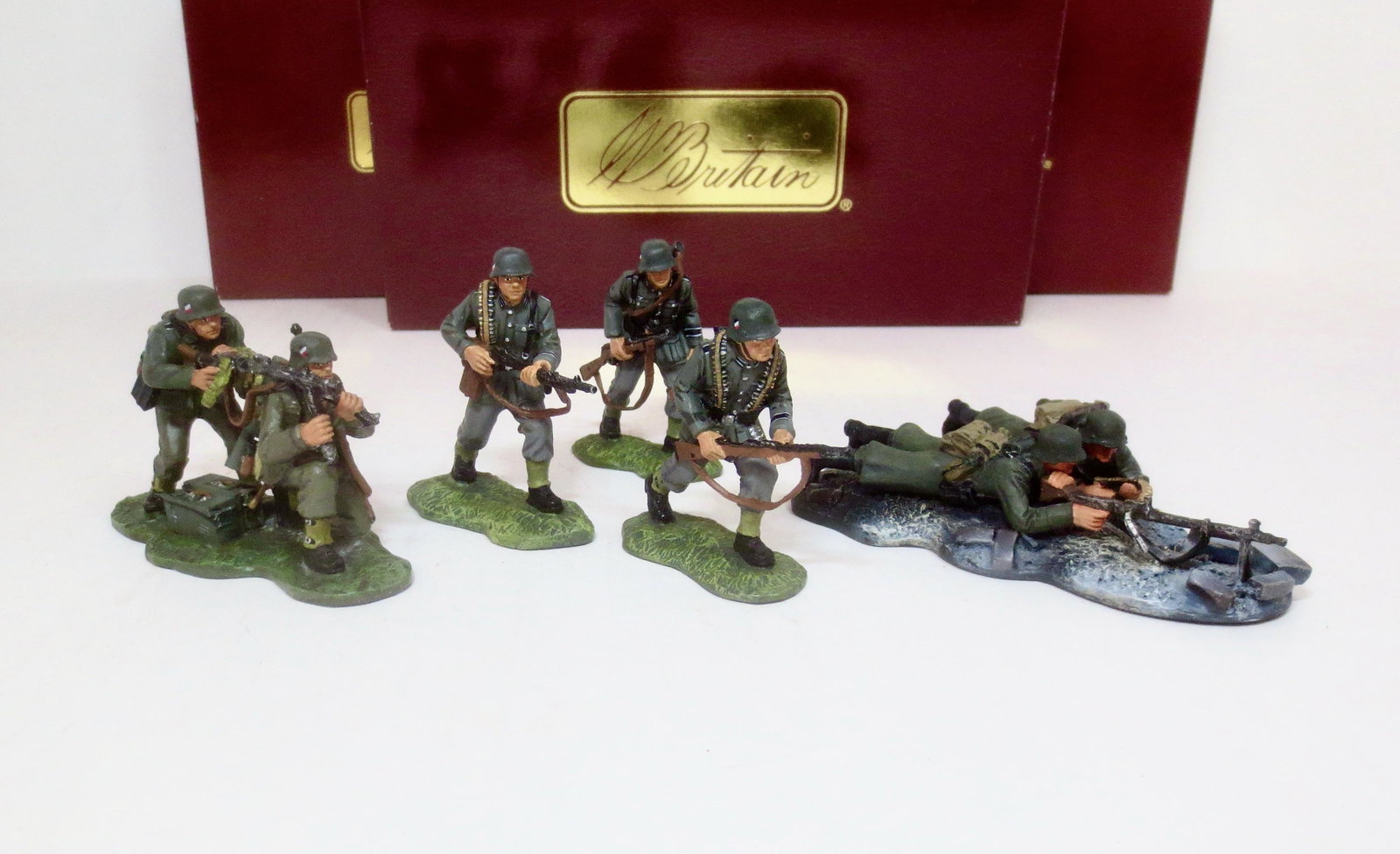 Britains World War Two Sets: German Machine Gun Set #17593, German Machine Gun Set #17493, and German Armor Support Team #17495.