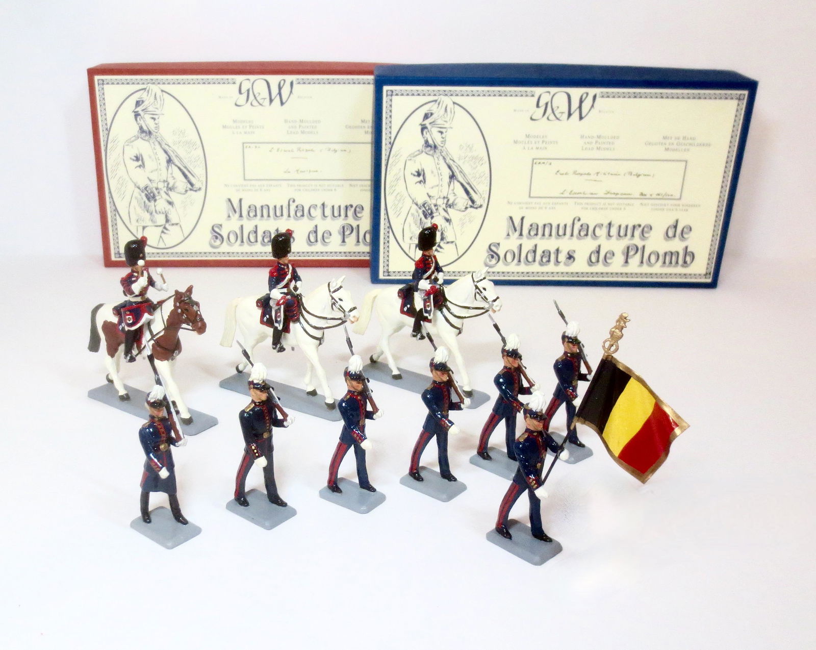 G&W Royal Military of Belgium: Infantry and Mounted Drum & Bugle sets. 10 pieces. Near mint condition (one loose arm). Boxes excellent.
