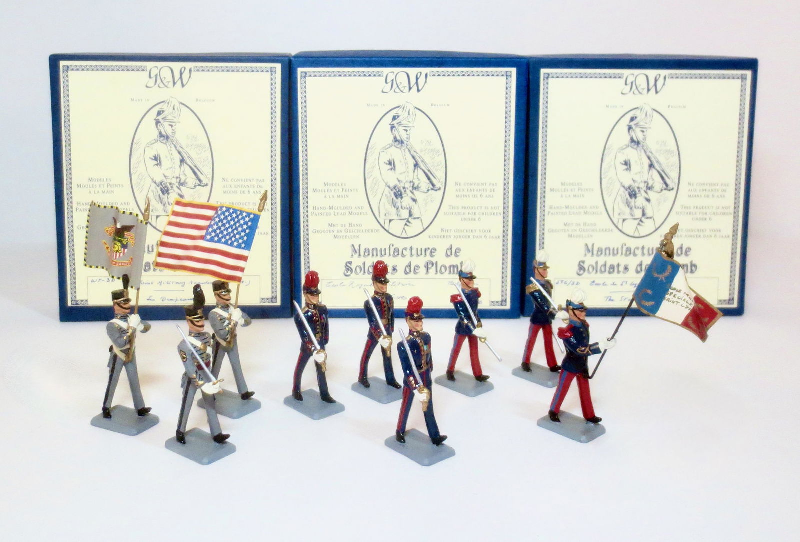 G&W Assorted Regiments: West Point Cadets, Belgium Infantry, and Prussian Infantry. 9 pieces. Mint to near mint condition. Boxes excellent.