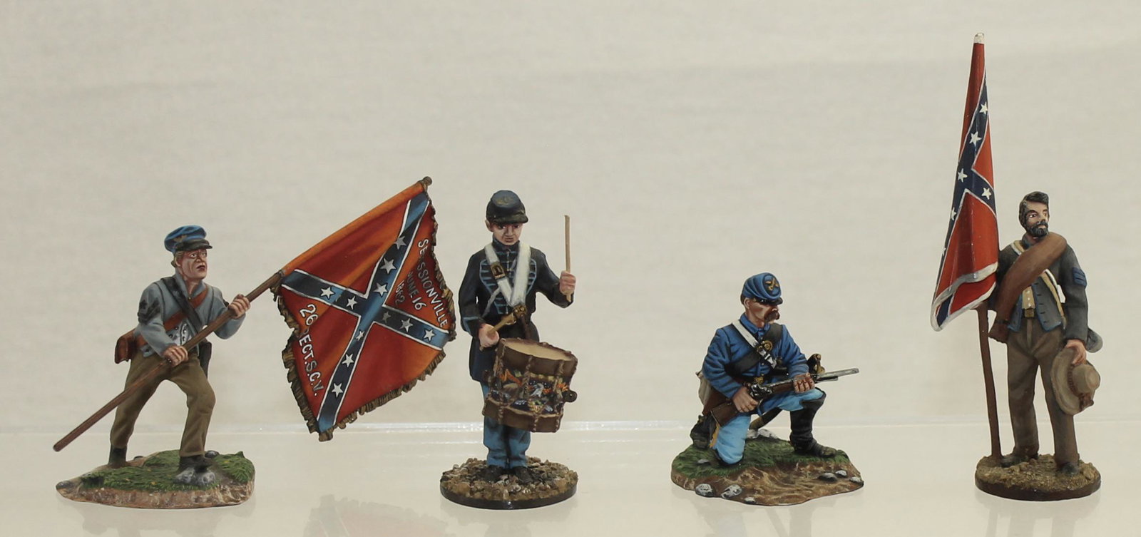 Lot Union Drummer Confederate Flag Bearers: American Civil War. Lot includes 2 Confederate Flag Bearers, Union Drummer and Union Infantryman Charging with Rifle. All Made by Russian Studios. 4 Pieces. Condition Very Good to Excellent. Large Bat