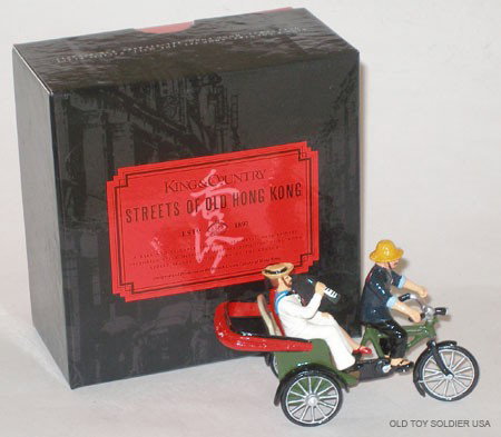 King and Country Streets of Hong Kong- Box: King and Country Streets of Hong Kong. Bicycle Rickshaw, Coolie and Sailor and Girl Passengers with Original Box. 4 Pieces.