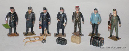 Britains Railway Staff.: Britains Railway Staff. Porters, Station Master, Ticket Collector, Guard and Stoker, Trolley, Golf Bag and Sticks and Various Luggage. Pre War. 12 Pieces. Unboxed.