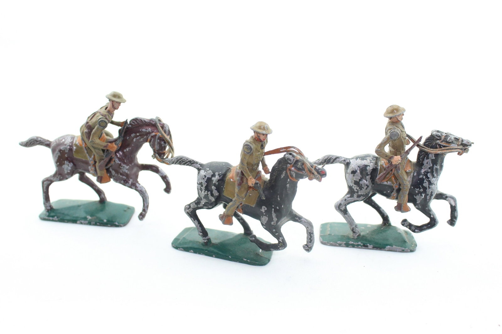 Warren Lines U.S. Cavalry: Three pieces, (3 horses, 3 riders), officer with pistol, 2 troopers with rifles, Poor to VG, riders VG, horses paint-chipped, missing reins.