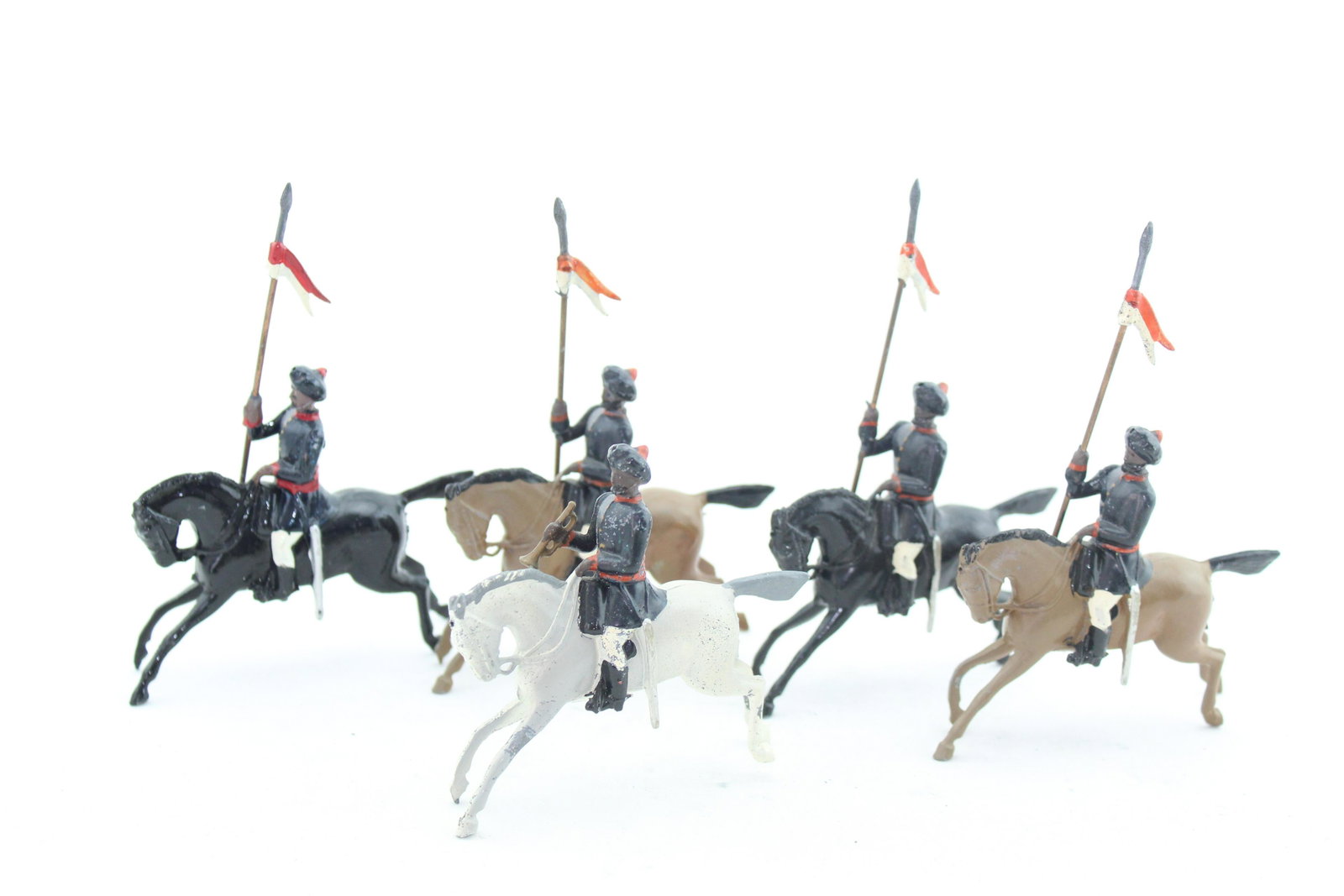 Britains #66 13th Duke of Connaught's Lancers: Five pcs, early postwar, G/VG, blue tunics, one loose lance arm, chips on some horses' legs. No box.