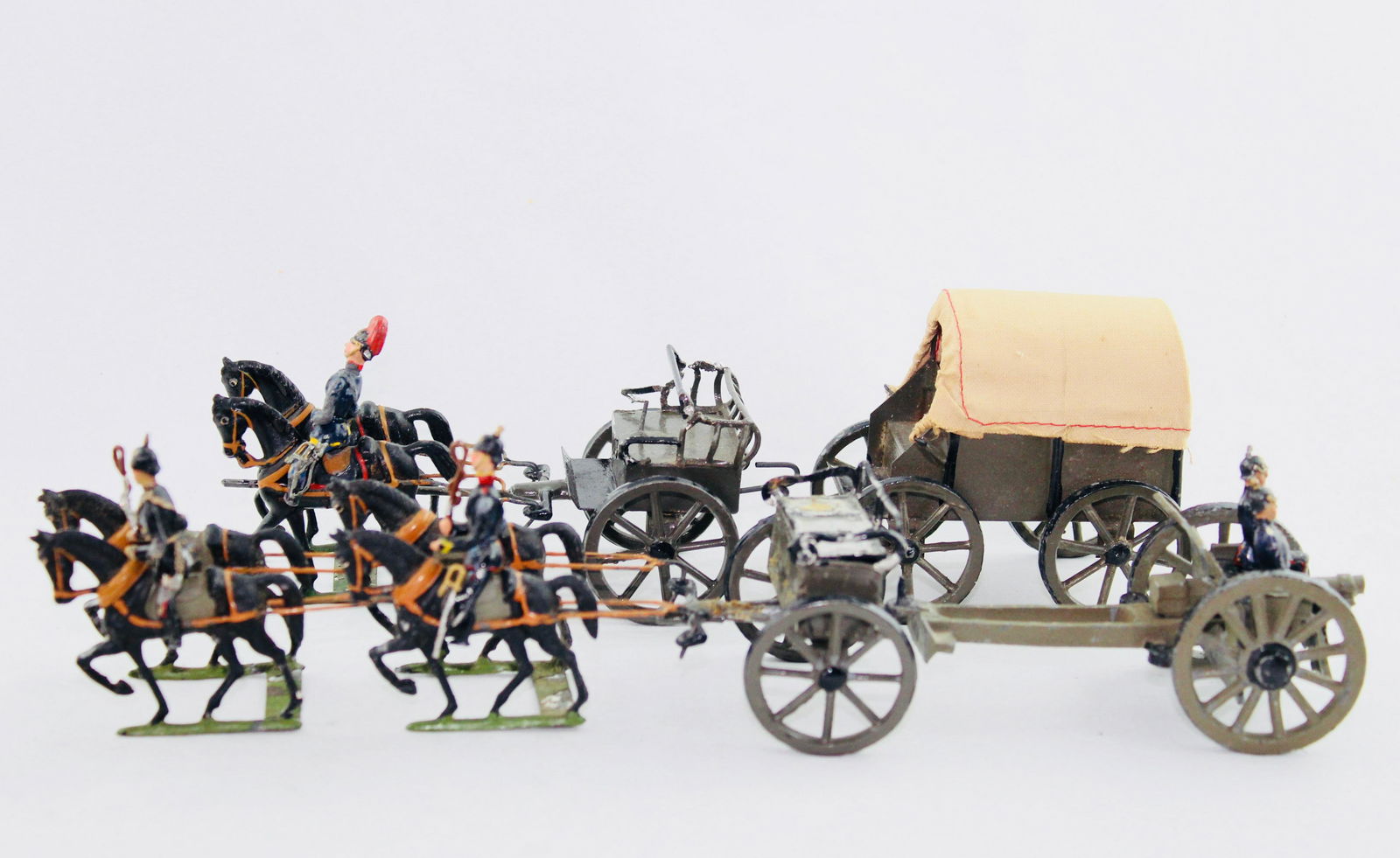 Heyde German Field Artillery Supply: Fifteen pieces, 48 mm, circa 1910, Imperial German field artillery, with 6 horses, 3 drivers, 2 limbers, gun with 2 seated gunners, and separate supply wagon, VG, one limber has loose seat back. No bo