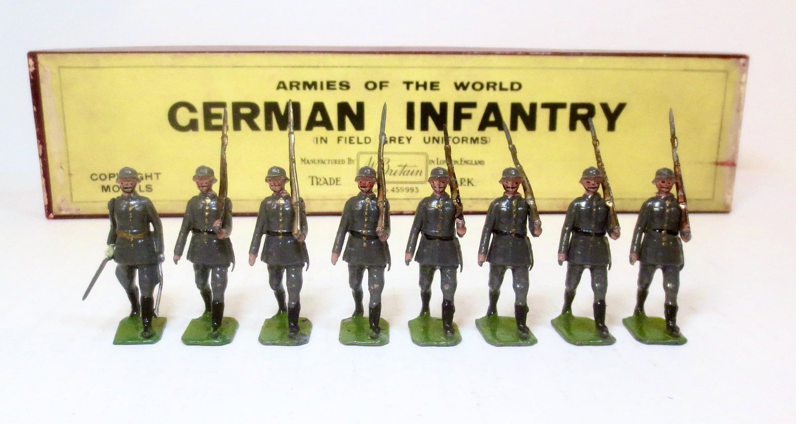 Britains #432 German Infantry: In field grey uniforms. Pre war issue. 8 pieces. Excellent condition. Printers label box in excellent condition.
