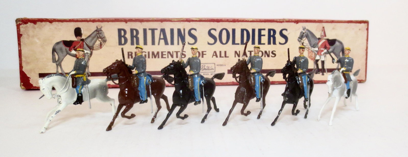 Britains From #2055 Confederate Cavalry: Post war issue. 6 pieces (with an added officer as substitute for missing bugler). Excellent condition. Box poor).