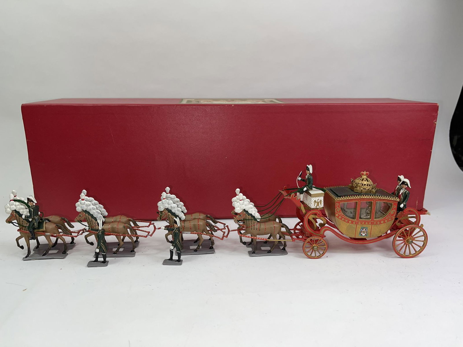 Mignot Imperial Carriage Set 824: 8 horse Imperial carriage with Napoleon and Josephine seated, in excellent condition. Light wear to the traces. Includes original box in excellent condition.
