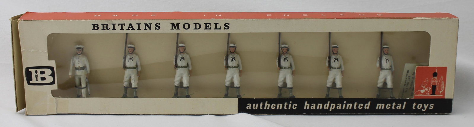 Britains Set 9184 USA Sailors Marching: In Cello Front Box. 7 Pieces. Condition Excellent. Box Good. One End Flap Torn. Old Sticky Tape Applied to Rip on Box Top.