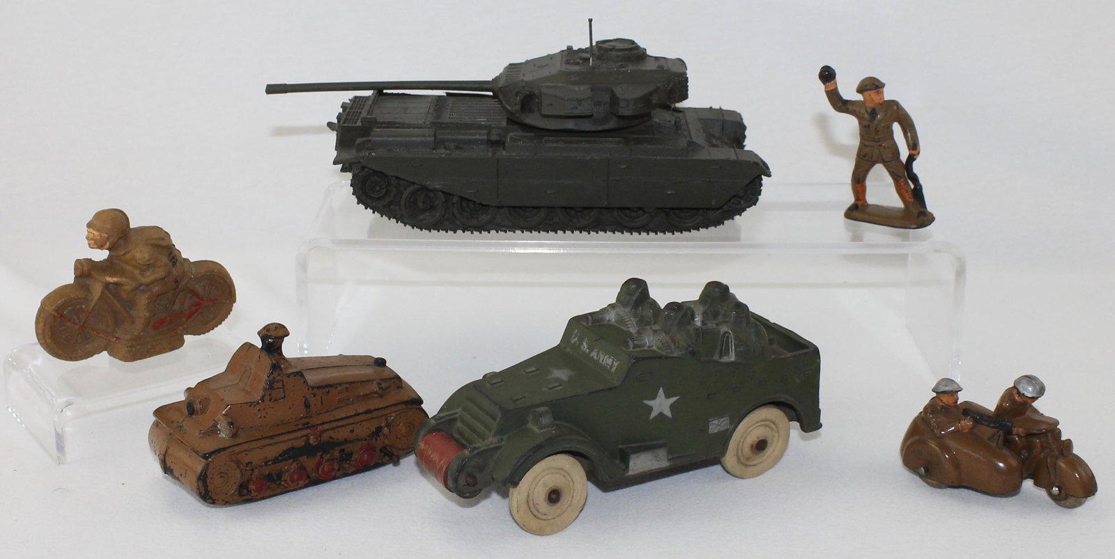 Lot of Rubber and Composition Vehicles: Lot includes Army Scout Car with White Rubber Tires by Sun Plastics, Tank, Grenade Thrower and Motorcycle Machine Gunner By Auburn, Composition Motorcyclist by Plywood Plastics and a Resin Copy of Bri