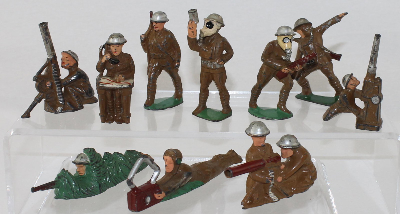 Manoil Lot Sniper Anti Aircraft Gun: Dimestore Series. Lot includes Manoil #M87 Sniper, #M94 Man with Flare Gun, #M117 Man with Radar, #M74 Anti Aircraft Gun, #M108 Machine Gun Crew and Others. 10 Pieces. Condition Fair to Good. One Rifl