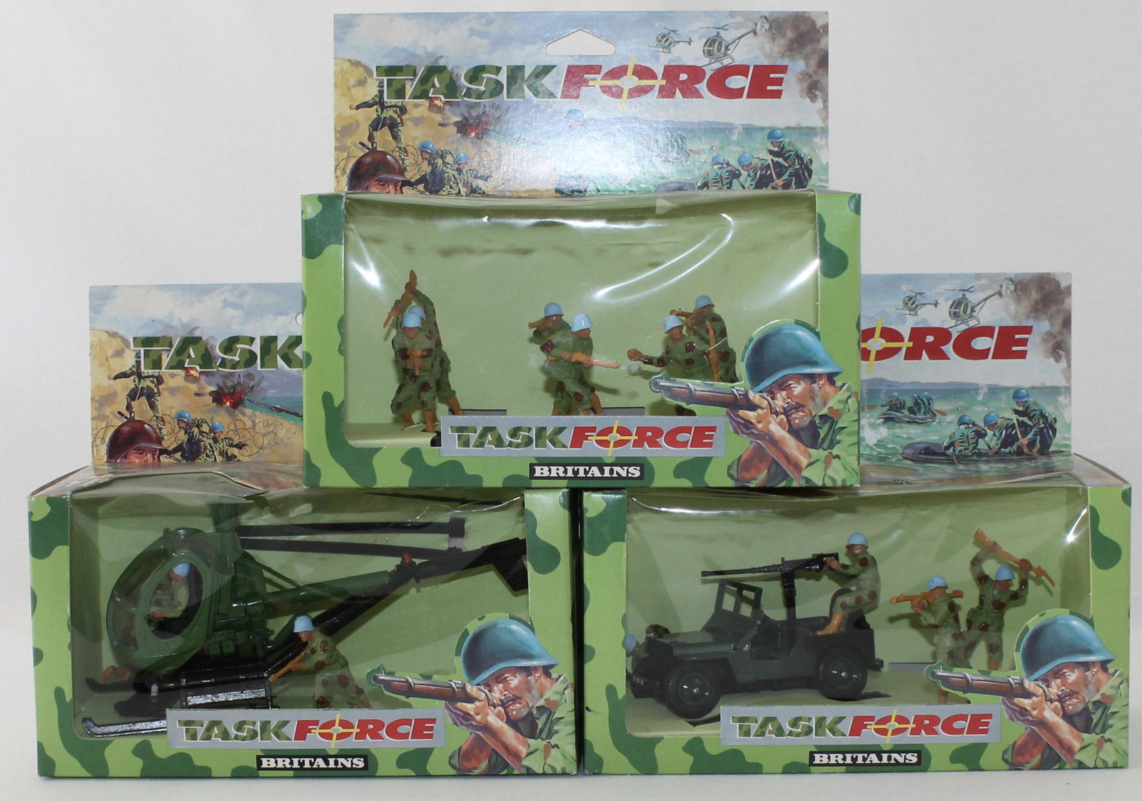 Britains Lot Helicopter Jeep and Crew: Task Force Series. Lot Includes Action Figures Set #7603, Jeep with Gun Crew Set #7610 and Helicopter with Crew Set #7612. 10 Pieces. Condition Mint in Box. Boxes Very Good to Excellent. Cello Torn on