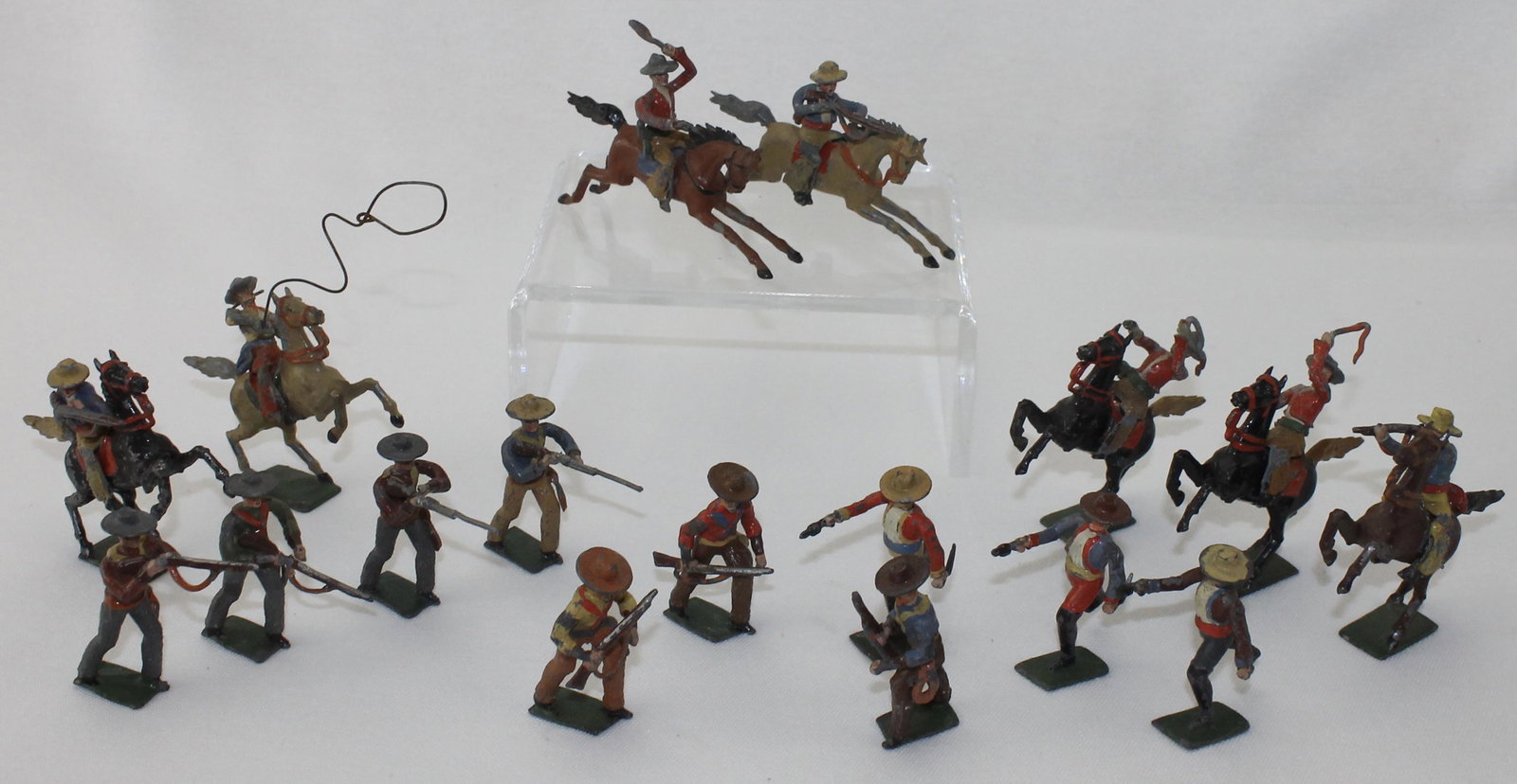 Spenkuch Lot Cowboys: 48mm. Spenkuch of Germany. Mounted and Foot. 17 Pieces. Condition Fair to Good. Few Weapons Bent or Damaged. No Box.