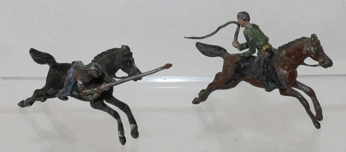 Heyde Lot Buffalo Bill Trick Riders: Size 2 (48mm). Trick Riders From the Buffalo Bill Show. Includes Cowboy Seated Backwards in Saddle and Indian Straddling Side of Horse with Rifle. Seldom Seen. 2 Pieces. Condition Fair. No Box.