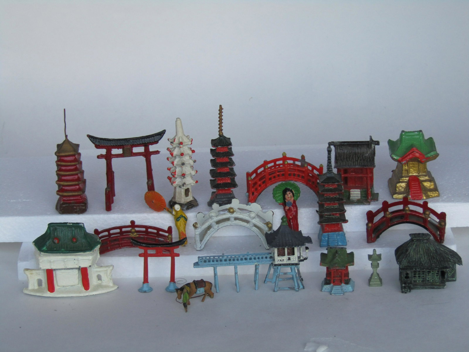 Twenty-piece Miniature Metal Chinese Buildings: Including bridges, gates and shrines. Excellent Condition.