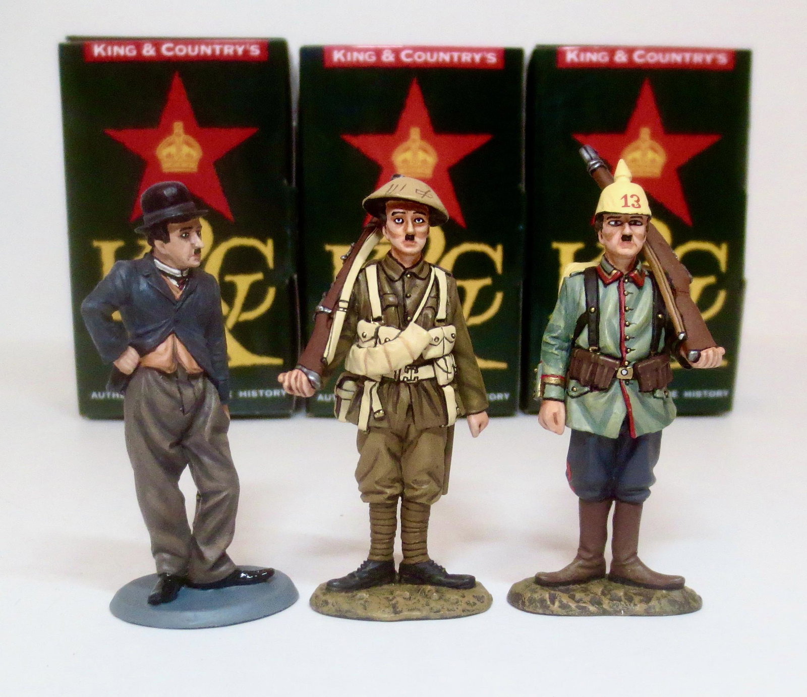 King & Country Collectors Club Charlie Chaplin: As The Tramp, In World War One British Uniform, and as "The Universal Fritz". 3 pieces. Mint condition. Boxes excellent.