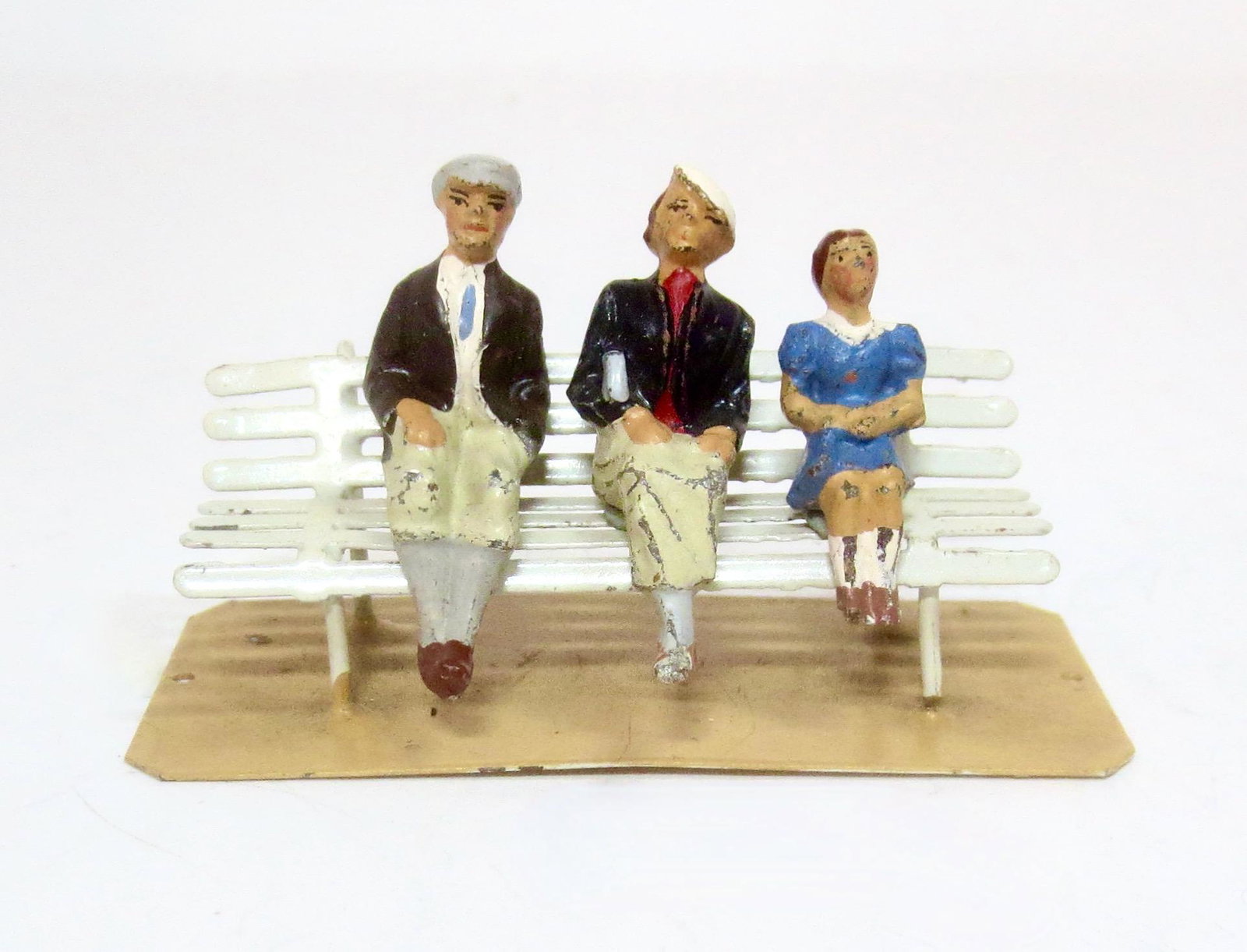 Marklin Family on Bench: 4 pieces. 40mm scale. Near mint condition. Unboxed.