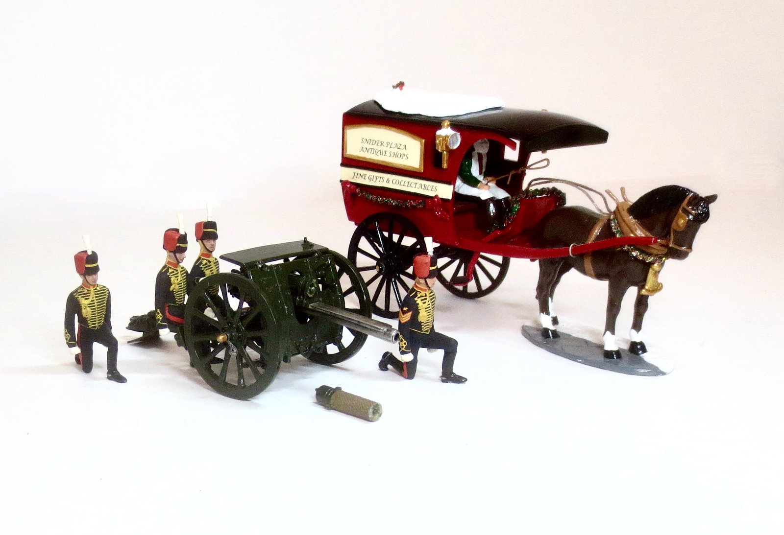 Britains #8927 Royal Horse Artillery: Review Order Detachment with 13 Pdr. Gun. In good condition (one loose cannon piece, included for repair. And Trophy Miniatures Horse Drawn Antique Shop Carriage with Santa holding the reins, in near 