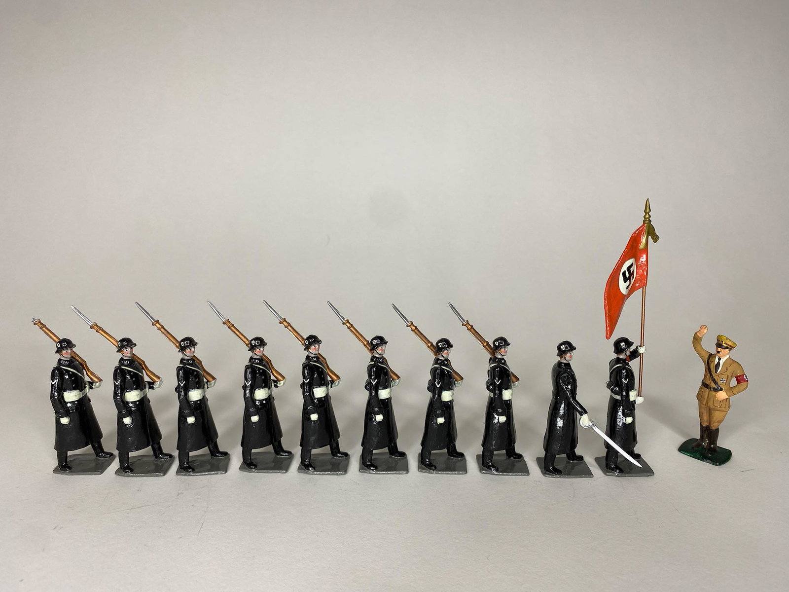 Bill O'Brien Hitler SS Body Guard: Bill O'Brien special paint and configuration of Hitler's SS Body Guard. 8 troops with fixed bayonets and S/S death uniform, 1 Nazi flag bearer, 1 Officer, 1 Adolf Hitler. Only set in existence. 10 pie