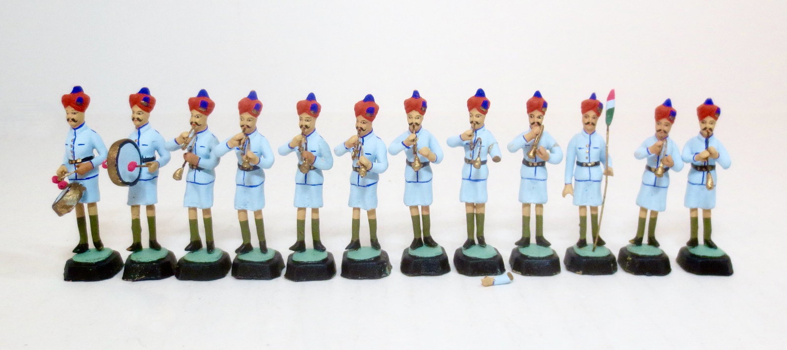 Police Band of India: Composition. 50mm tall on base. 12 pieces. Mint to near mint condition (one broken arm included for repair). No box.