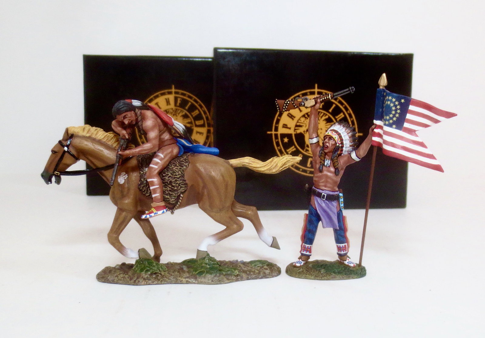 King & Country The Real West Pathfinders: Two Moons #TRW040(P), and American Flag #TRW046(P). 2 pieces. Mint condition. Boxes excellent.