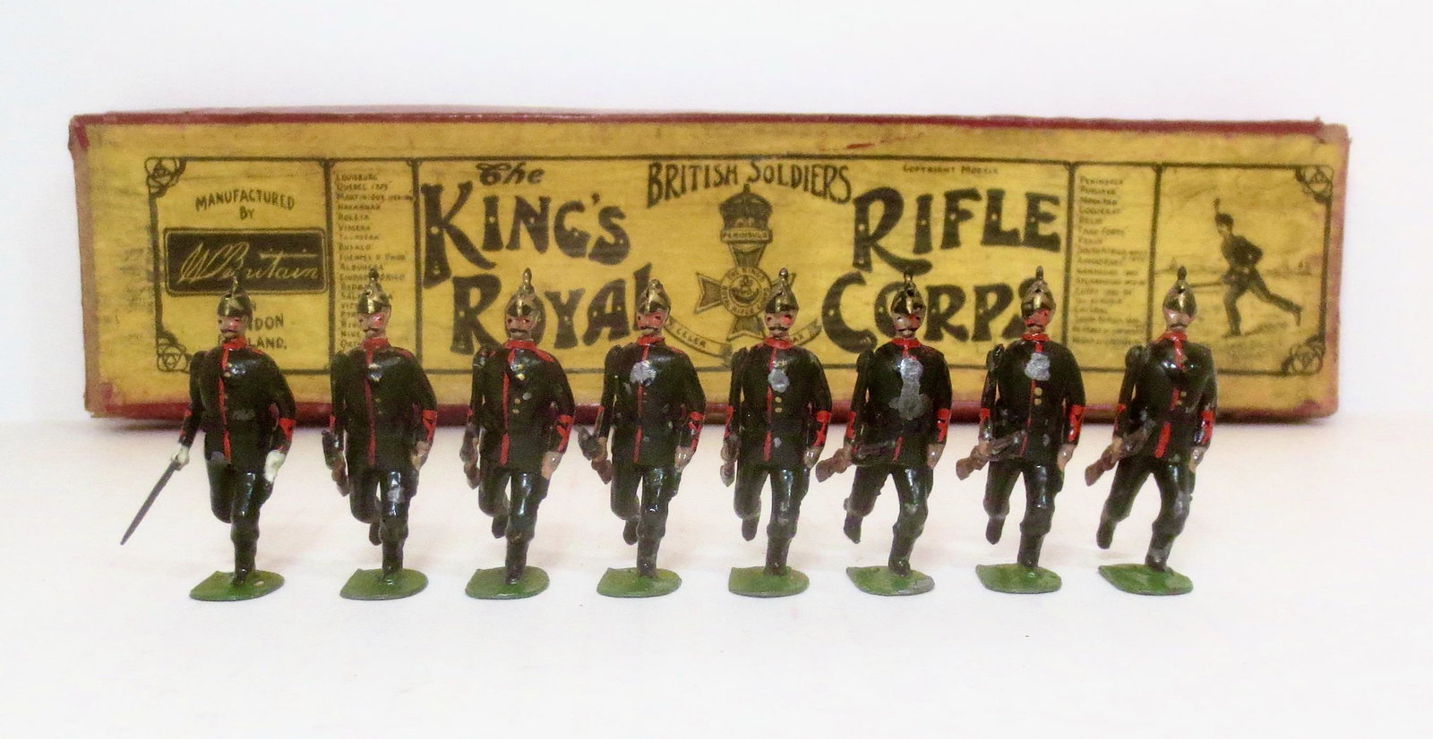 Britains #98 King's Royal Rifle Corps: RARE first version, circa 1899. 8 pieces. Excellent condition (one missing helmet spike). Whisstock label box in poor condition.