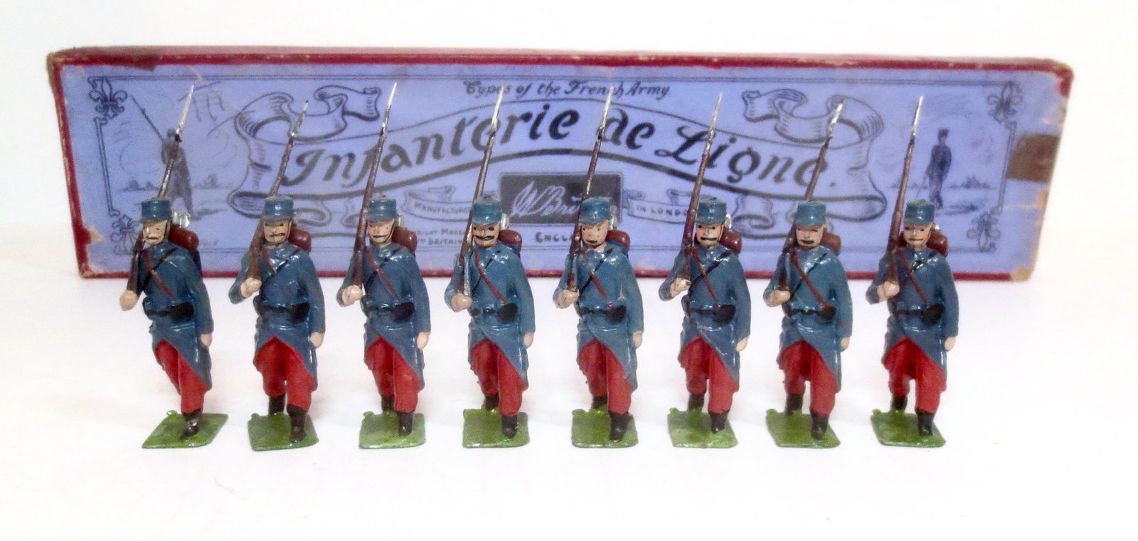 Britains #141 Infanterie de Ligne: Pre war issue. 8 pieces. Near mint condition. Whisstock label box poor.