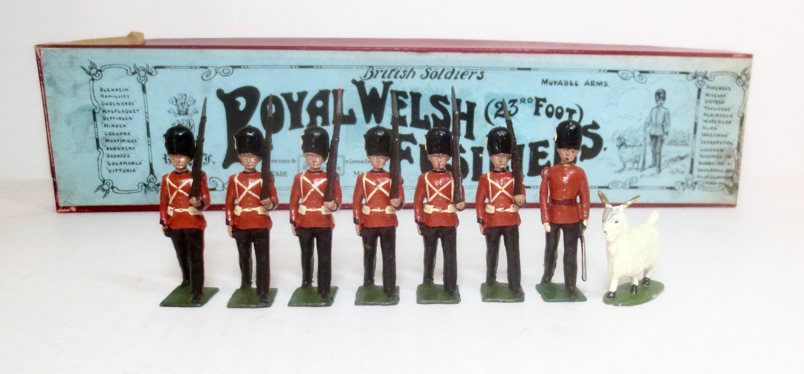 Britains #74 The Royal Welch Fusiliers: With officer and goat mascot. Post war. 8 pieces. Near mint condition. Box good (missing tie card).