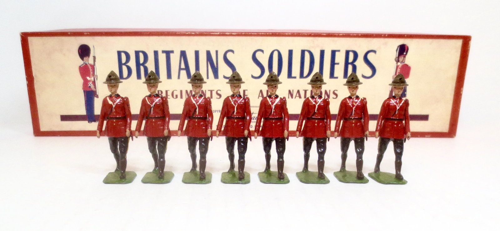 Britains #1554 Royal Canadian Mounted Police: Dismounted. Post war issue. 8 pieces. Mint condition. Box very good, but missing tie card.