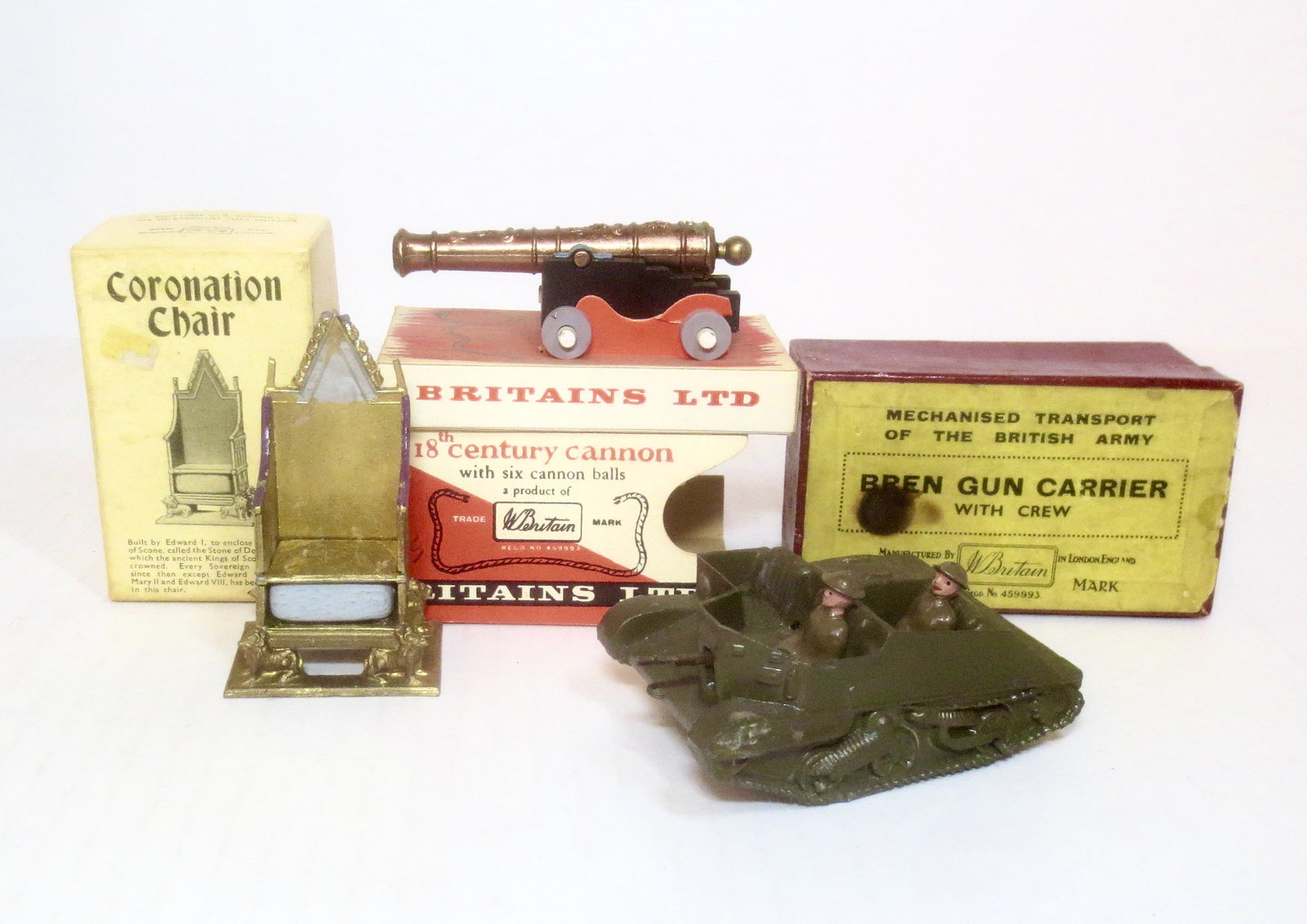 Britains Boxed Set Assortment: Coronation Chair #86D in good condition with an excellent box. 18th Century Cannon #9721 in mint condition with an excellent box, and Bren Gun Carrier with Crew #1876 in very good condition, but missi