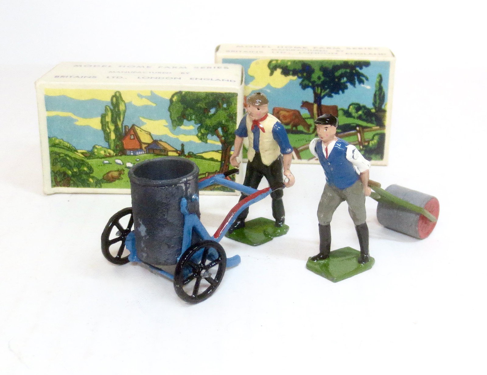 Britains Civilian Farm Hands: Man with Tank on Wheeled Cart #5034, and Man with Roller #5032. 4 pieces. Mint to near mint condition. Boxes excellent.