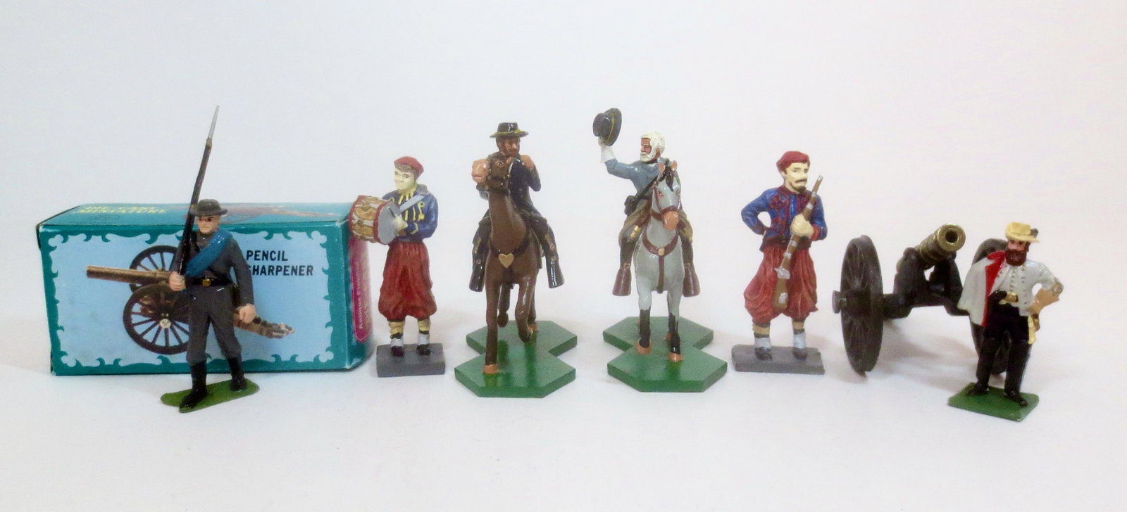 Civil War Assorted Figures and Artillery: One plastic Marx figure, the rest metal. 8 pieces. Mint to near mint condition. One gun is a pencil sharpener and is boxed, the rest unboxed.