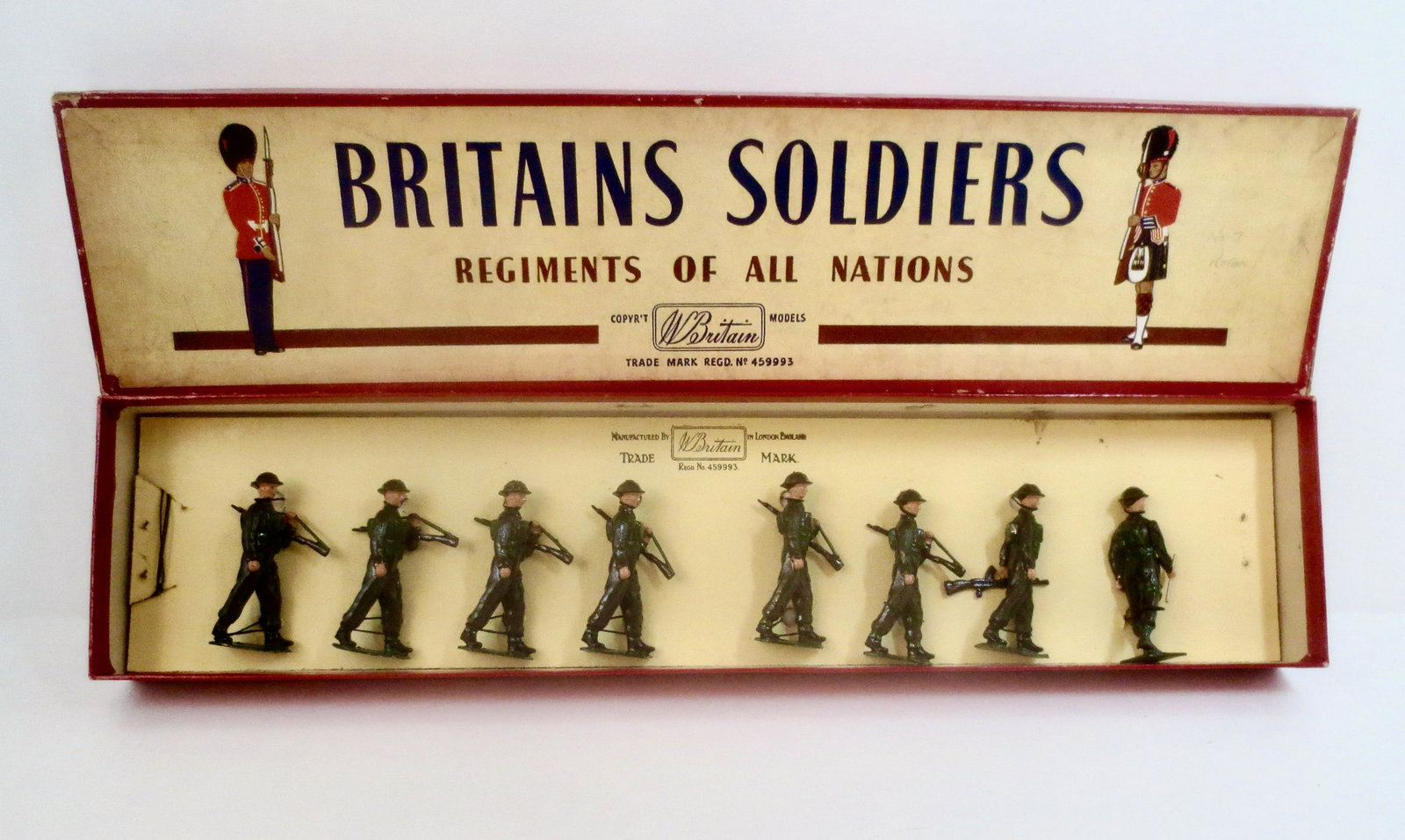 Britains #1858 British Infantry: In full Battle Dress. Post war issue. 8 pieces. Mint to near mint condition, retied to card in box. Box very good (2 top corner splits).