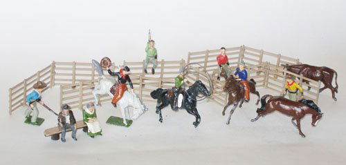 Britains From Set # 2043 Rodeo: Britains From Set # 2043 Rodeo Post War. Unboxed. Scarce Cowboys On Bucking Bronco, Seated with Pistol, and Seated with Hat in Air. Two Mounted Cowboys, Seated Pioneer and Wife with Log Seat, Two Foot