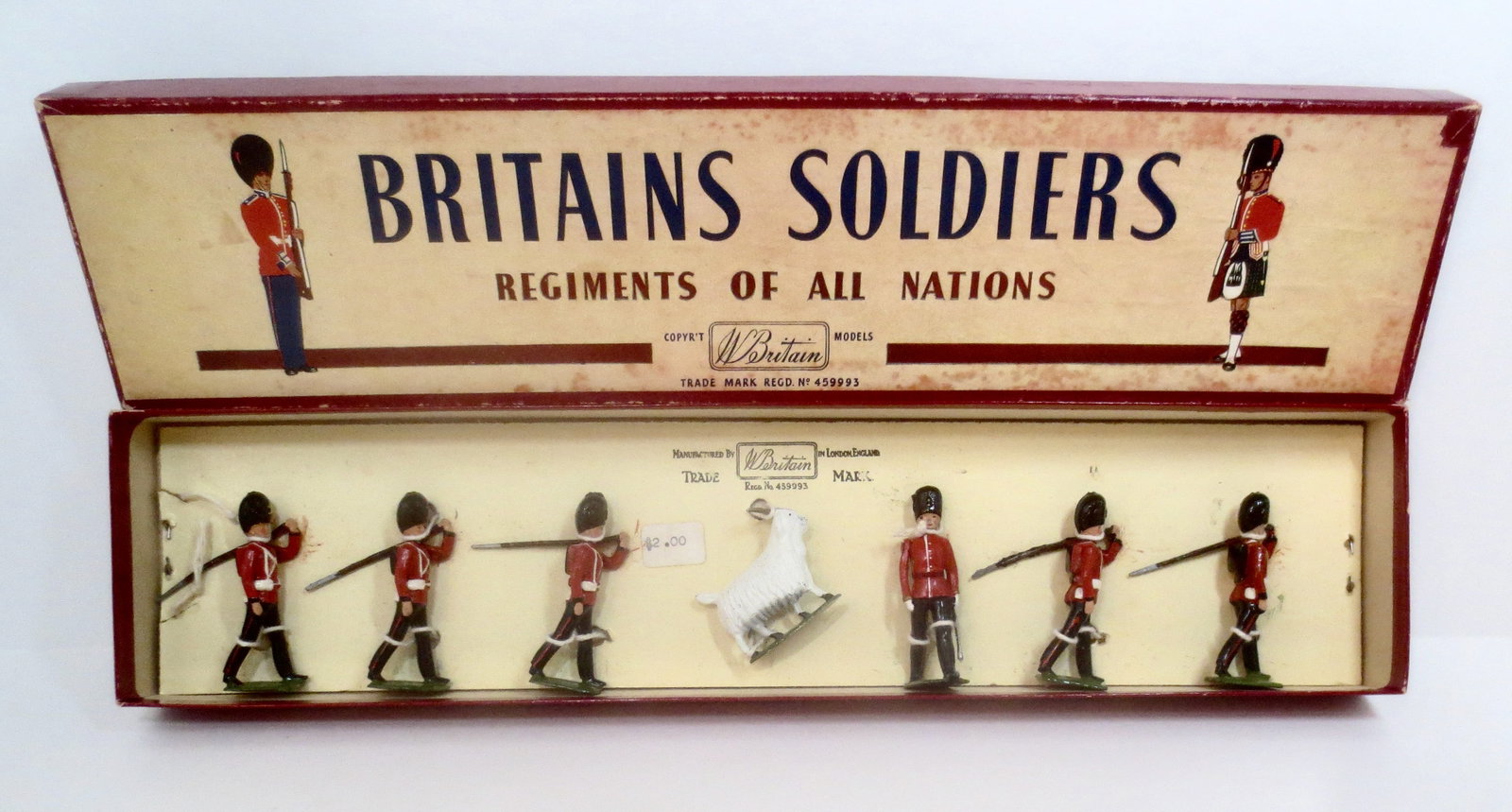 Britains #74 Royal Welch Fusiliers: With Officer and Goat Mascot. Post war issue. 7 pieces. Mint to near mint condition, retied to card in box. Box excellent.