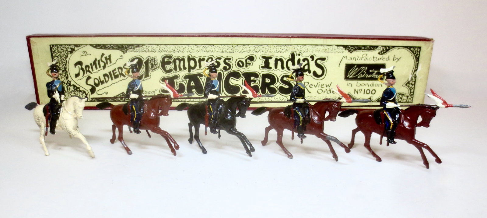 Britains #100 21st Empress of India's Lancers: Pre war issue. 5 pieces. Excellent condition (one mismatched non-mustached lancer). Whisstock labeled box excellent.