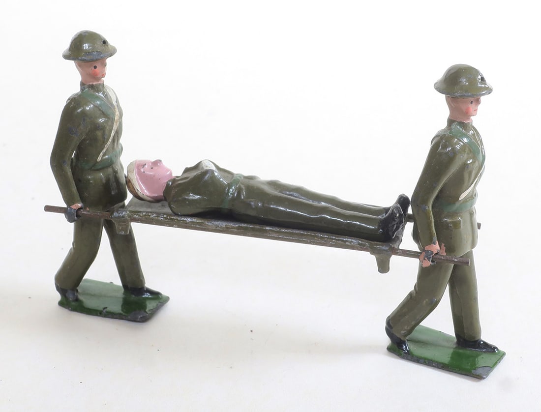 Britains set #1719, Stretcher party: rare version in steel helmets and full trousers, very good, 4 pieces, (c. 1938)