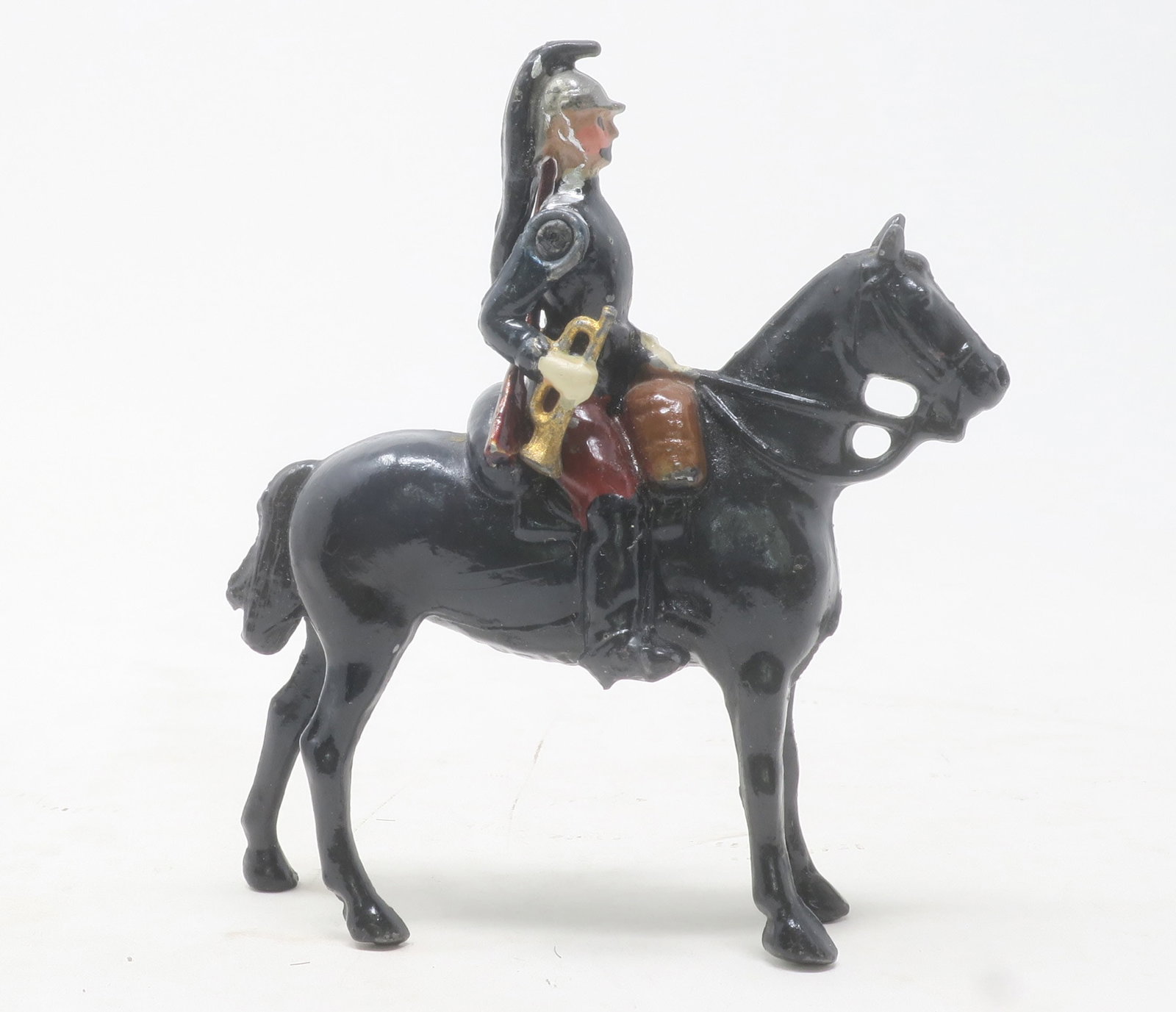Britains, Paris Office Dragon: trumpeter at the halt, black horse, plug in carbine, Paris Office paint finish, with no lace, good, 1 piece, (c. 1910)
