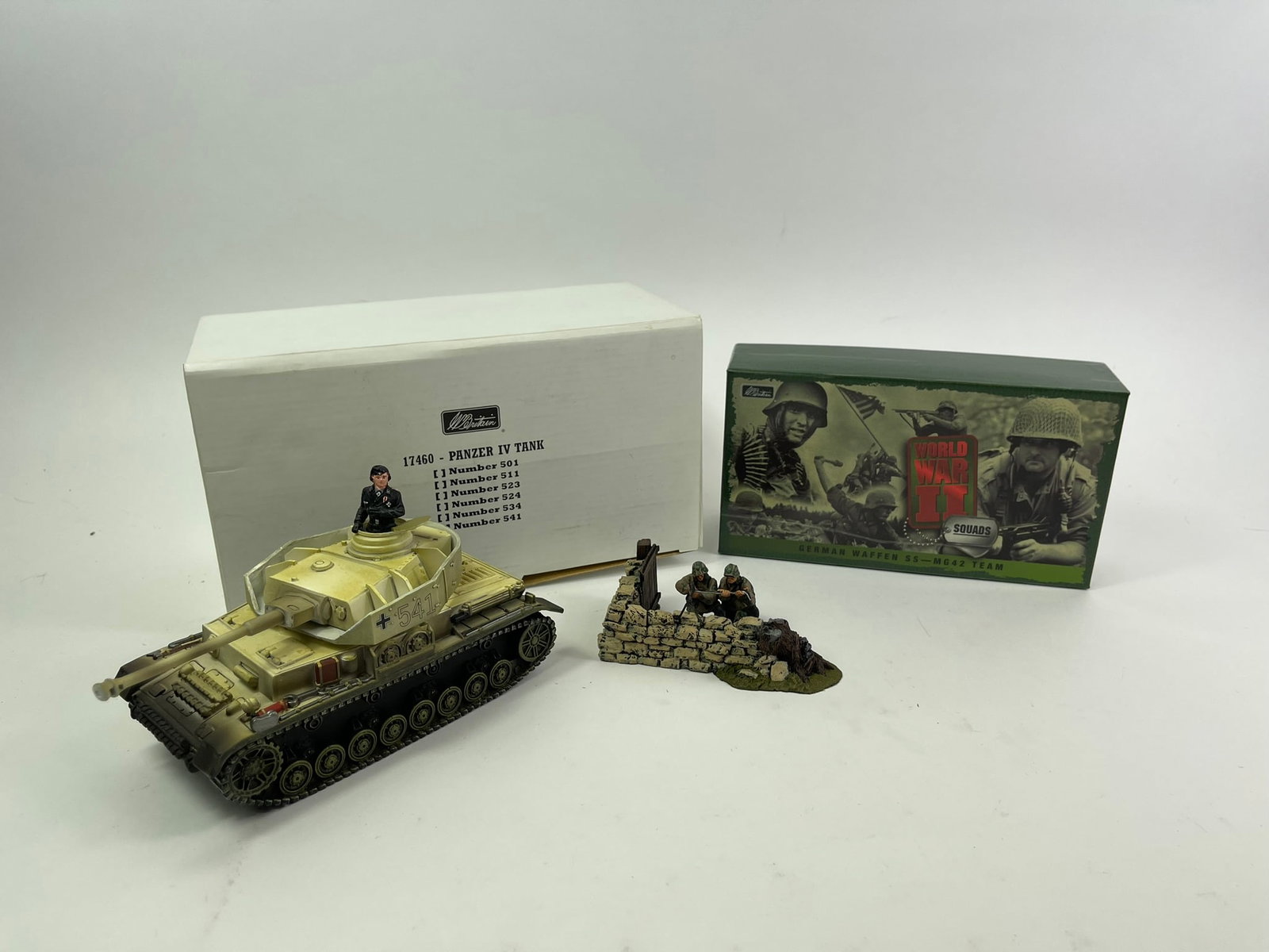 Britains WWII German Collection: Two complete sets with original boxes, figures in excellent to near mint condition. Sets included are #17147 "German Waffen SS - MG42 Team" and #17460 "Panzer IV Tank".