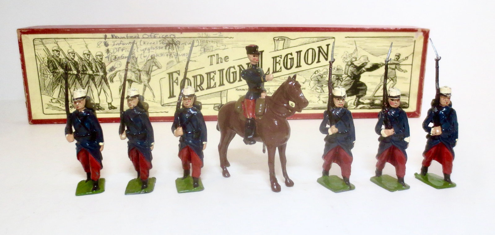 Britains #1711 French Foreign Legion: Post war issue. 7 pieces. One missing bayonet, the rest in near mint condition. Box fair (ink writing on top label).