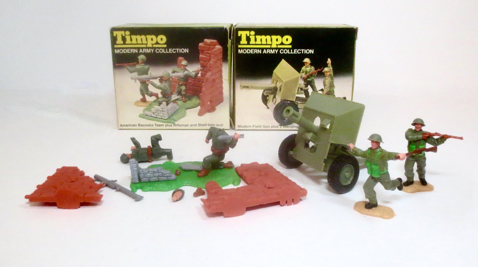 Timpo Modern Army Sets With Field Gun: 10 pieces. Some broken pieces.. Boxes excellent.