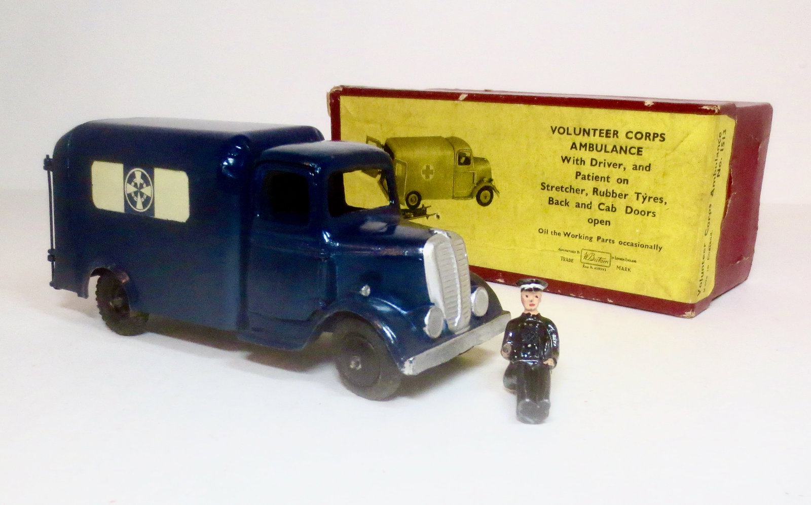 Britains #1513 Volunteer Corps Ambulance: 2nd version with round nose. Issued 1948-1956. 2 pieces, missing wounded and stretcher. Excellent condition (front tires brittle and a little loose). Box very good.
